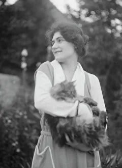 Portrait Photographs Prints: Savagoy, Henriette, with cat, outdoors, 1922 July 31. Creator: Arnold Genthe
