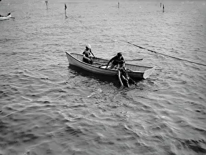 Lifesaving Prints: Saving a life, between 1900 and 1905. Creator: Unknown