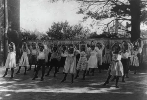 Physical Education Prints: School children learning a dance in a school yard