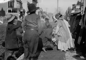 Bending Down Prints: Scramble for pennies, Thanksgiving, between c1910 and c1915. Creator: Bain News Service