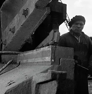 Scrap Metal Prints: Scrapyard worker, Rotherham, South Yorkshire, 1963. Artist: Michael Walters