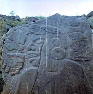 Monte Alban Prints: Detail of a sculptural relief on a rock representing a man with a large earring