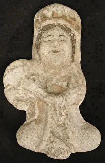 Seated tambourine player, Iran, 12th century. Creator: Unknown