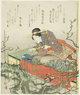 Brush Collection: Seated woman holding brush and poem card, early 1830s. Creator: Totoya Hokkei