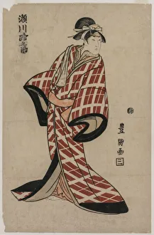 Segawa Michinosuke Wearing a Padded Plaid Robe, c. 1805. Creator: Utagawa Toyokuni (Japanese