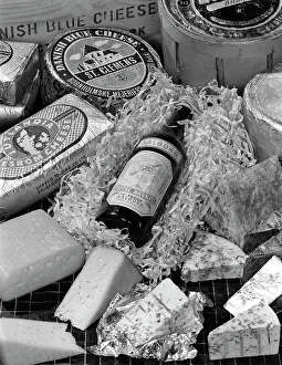 A selection of Danish cheeses and a bottle of Aalborg aquavit, 1963 A selection of Danish cheeses and a bottle of Aalborg aquavit, 1963