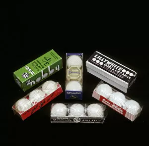 Images Dated 2nd August 2005: Selection of golf balls in their packaging, mid 20th century. Artist: Wilson Sporting Goods