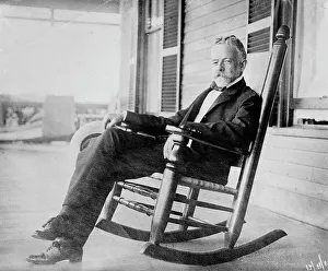 Porch Prints: Sen. H.C. Lodge in rocker on porch, 1910. Creator: Bain News Service