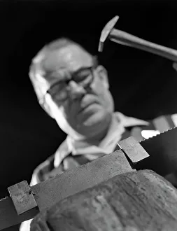 Steelworker Prints: Setting the saw teeth on a hand saw blade, Sheffield, South Yorkshire, 1963. Artist