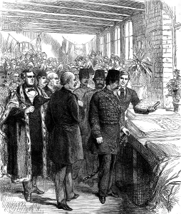 Cotton Prints: The Shah at Manchester: inspecting a piece of calico printed with Persian words of welcome