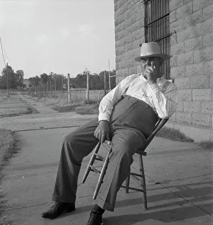 The sheriff of McAlester, Oklahoma, sitting in front of the jail, 1936. Creator: Dorothea Lange
