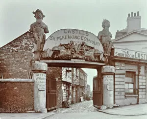 Greater London Council Gallery: Ships figureheads over the gate at Castles Shipbreaking Yard, Westminster, London, 1909