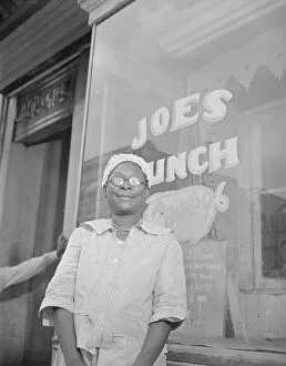 Parks Gordon Roger Alexander Buchanan Collection: Shopper on Saturday afternoon, Washington, D.C. 1942. Creator: Gordon Parks