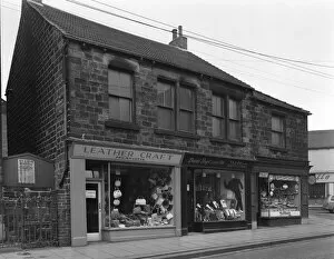 Clothes Shop Gallery: Shops in Bank Street, Mexborough, South Yorkshire, 1963. Artist: Michael Walters