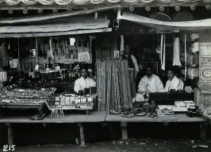 Shop Owner Prints: Two shops or market stalls, in Korea, c1900. Creator: Unknown