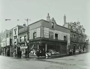 Guildhall Library Art Gallery: Shops and sign to Putney Roller Skating Rink, Putney Bridge Road, London, 1911