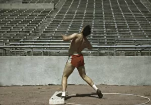 Athletics Gallery: Shot putter, University of Nebraska, 1942. Creator: John Vachon