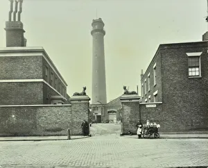 Milk Churn Prints: Shot Tower, gates with sphinxes, and milk cart, Belvedere Road, Lambeth, London, 1930