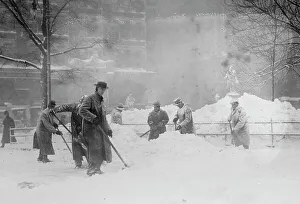 Shovel Prints: Shovelling snow in City Hall Park, New York, 1910. Creator: Bain News Service