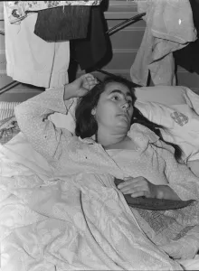 Sickness Collection: Sick woman in FSA camp for migratory agricultural workers, Tulare County, California, 1939