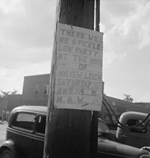 Party Gallery: Sign tacked to pole near the post office, Main street, Pittsboro, North Carolina, 1939