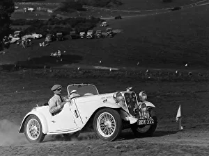 A Singer Nine Le Mans climbing a hill, 1935