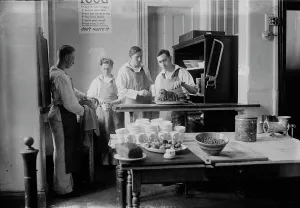 Aprons Prints: Sink & mop duty, between c1915 and 1918