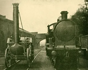 A full size model of Stephensons Rocket alongside an engine of the George A full size model of Stephensons Rocket alongside an engine of the George