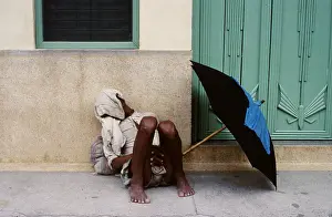 Umbrellas Prints: Sleeping man, Rajasthan, India, 1988. Creator: Amanda Waite