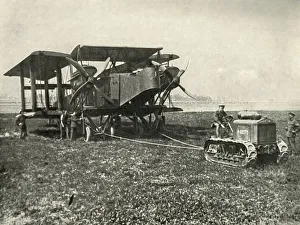 Aerodrome Prints: A Small Motor Tractor Getting a Huge R.A.F. Bombing Machine into Position... (1919)