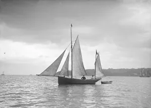 Towing Prints: Small yawl under sail, 1912. Creator: Kirk & Sons of Cowes
