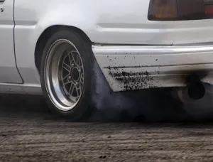 Rubber Collection: Smoking tyres during tyre burn-out. Creator: Unknown