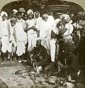 Squatting Prints: Snake charmer, Calcutta, India, c1900s(?). Artist: Underwood & Underwood