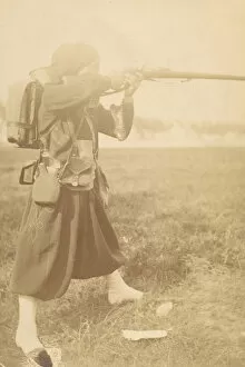 Zouave Gallery: [Soldier Aiming Rifle], 1880s-90s. Creator: Unknown