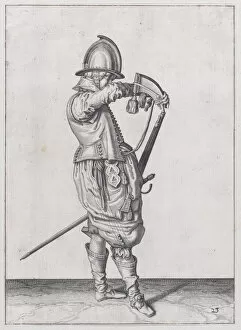 Firearms Collection: A soldier charging his caliver which is held stock down, from the Marksmen serie... published 1608