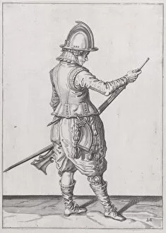 A soldier ramming home powder and bullet with the ramrod, from the Marksmen seri... published 1608