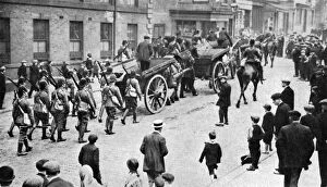 Bystanders Gallery: Soldiers convoying coal carts during the strike, Sheffield, c1920