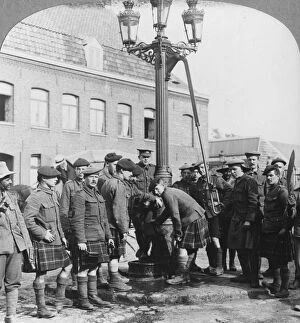 Soldiers filling their water bottles at the town pump La Gorgue, France, World War I, c1914-c1918
