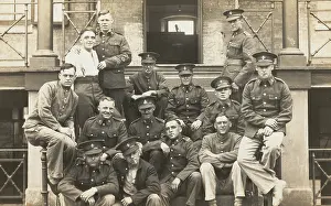 Scaffolding Prints: Soldiers posing for a group portrait outside a large building, c1910s. Creator: Unknown