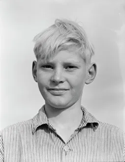 Son of migratory worker from Kansas in squatters camp near Farmersville, California, 1936. Creator: Dorothea Lange