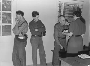 Elderly Gallery: Sons, migratory workers, bring father...to the camp clinic, FSA camp, Tulare County, CA, 1939