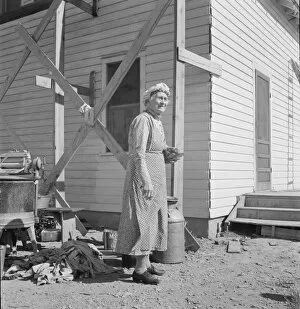 Milk Gallery: Soper grandmother helps the large family, Willow Creek area, Malheur County, Oregon, 1939