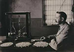 Employee Prints: South Africa: an employee of De Beers counting the diamonds mined that day