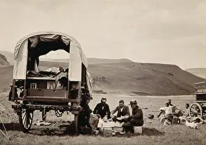 Waggon Prints: South Africa: a group of Europeans eating a meal beside their wagon in the Transvaal