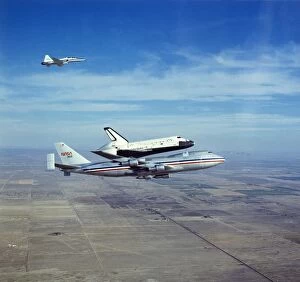 Airplane Collection: Space Shuttle Orbiter Columbia on Boeing 747 Shuttle Carrier, 1980s. Creator: NASA