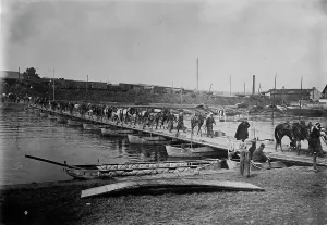 Compiegne Prints: Spahis cross boat bridge, Compiegne, 1914. Creator: Bain News Service