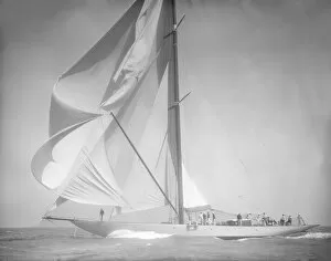 Spinnaker flying on unknown yacht. Creator: Kirk & Sons of Cowes