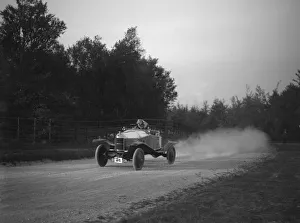 Exhaust Prints: Sports-bodied Morris 2-seater fitted with wheel discs. Artist: Bill Brunell