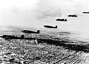 Occupied Prints: Squadron of German Heinkel He 111 bombers flying over occupied Paris, July 1940