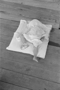 Bandaged Collection: Squeakie asleep (Othel Lee Burroughs), Child of a Hale County, Alabama cotton... 1936